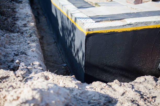 Professional Waterproofing technician working in Harpersville, AL